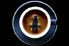 A staged photographic print with a LEGO figure Darth Vader in an Espresso coffee by New Zealand artist Adam Popovic, available at The Little Gallery Tairua